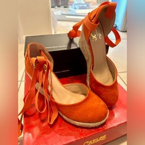 C. Wonder’s Covered, espadrille jute wedges, a deep orange hue, matching ties.
